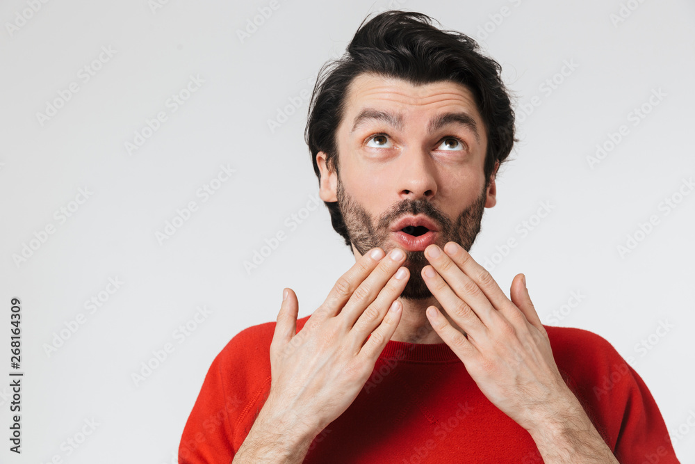 Man posing isolated over white wall background. Man posing isolated over white wall background.