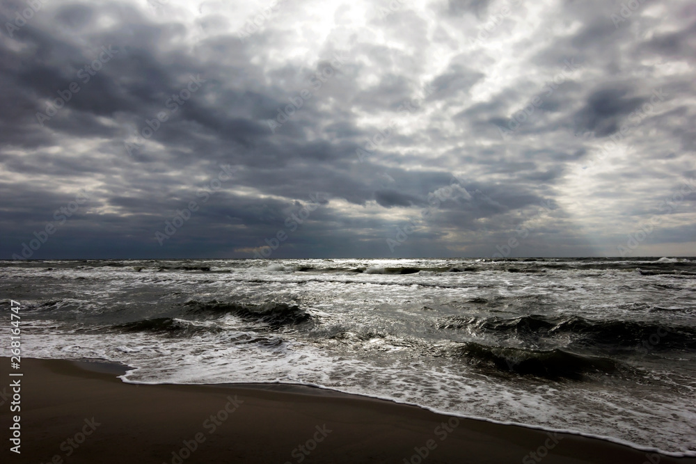 Beach in the village of Amber Kaliningrad region in Russia. Baltic sea. It's spring. Clouds above the beach.