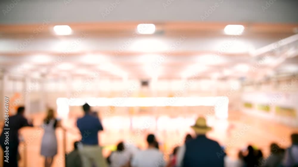 Unfocused scene of spectators watching their children playing a game on a sports field. Unfocused scene of spectators watching their children playing a game on a sports field.