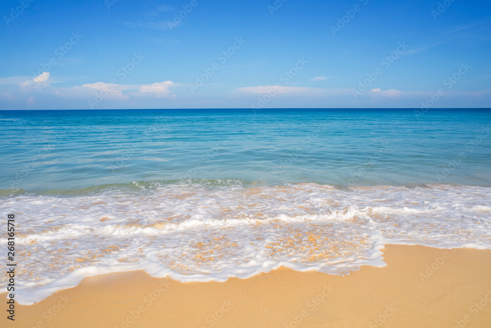 Beach sand and blue sea in blue sky