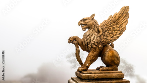 statue of Griffin or griffon a legendary creature with the body of a lion, the head and wings of an eagle
