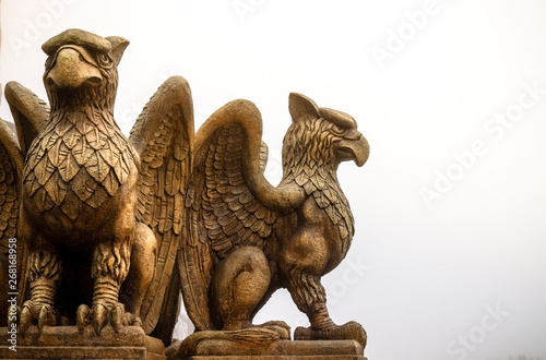 statue of Griffin or griffon a legendary creature with the body of a lion, the head and wings of an eagle