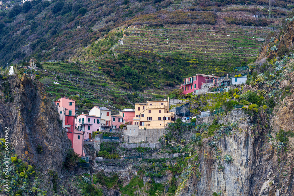 Naklejka premium Cinqueterre, Italy . 04-19-2019. View of Riomaggiore village one of five villages of Cinqueterre. Liguria. Italy. 