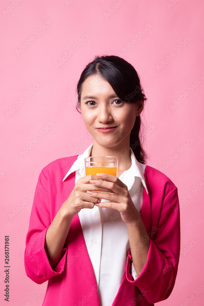 Young Asian woman drink orange juice. Young Asian woman drink orange juice.