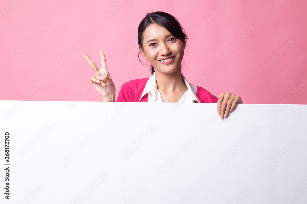 Young Asian woman show victory sign with blank sign. Young Asian woman show victory sign with blank sign.