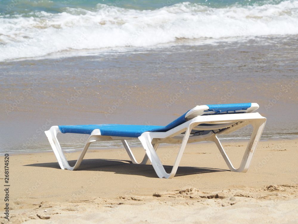 chaise lounge on the sandy beach of the Atlantic Ocean. chaise lounge on the sandy beach of the Atlantic Ocean.