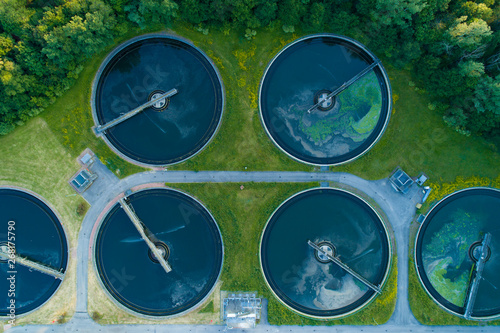 Aerial view of a city's waste management sewage and water treatment plants. Waste water purification. © Arcansél