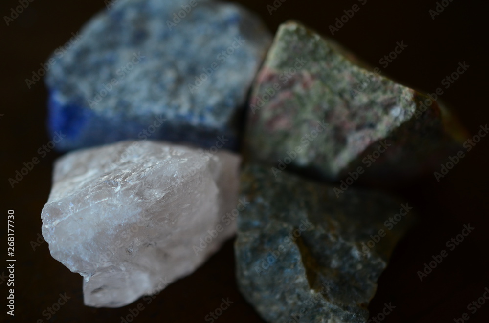 Set of 4 Raw Crystal Bundle. Natural Rough Crystals Kit: Unakite, Lapis Lazuli, Ocean Jasper, Rose Quartz. Crystal Variety Bundle Set. Low exposure natural light macro photography. Set of 4 Raw Crystal Bundle. Natural Rough Crystals Kit: Unakite, Lapis Lazuli, Ocean Jasper, Rose Quartz. Crystal Variety Bundle Set. Low exposure natural light macro photography.