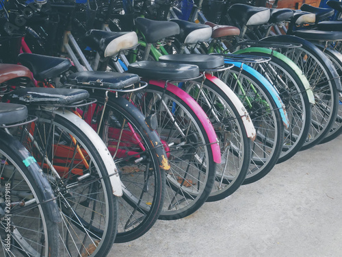 Back View of A Row of Colorful Bicycles Parking on Street
