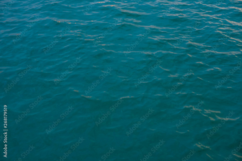 beautiful texture of sea water with shallow wave, top view. thick blue-turquoise color.