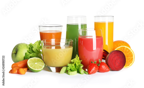 Glasses with different juices and fresh fruits and vegetables on white background