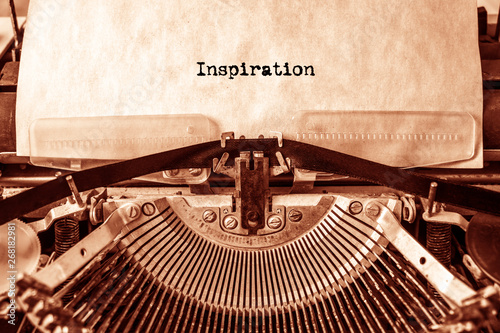 Inspiration printed on a sheet of paper on a vintage typewriter. writer, journalist.