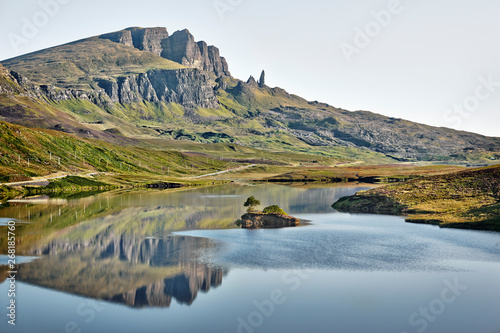 A mountainous landscape reflected in a tranquil lake