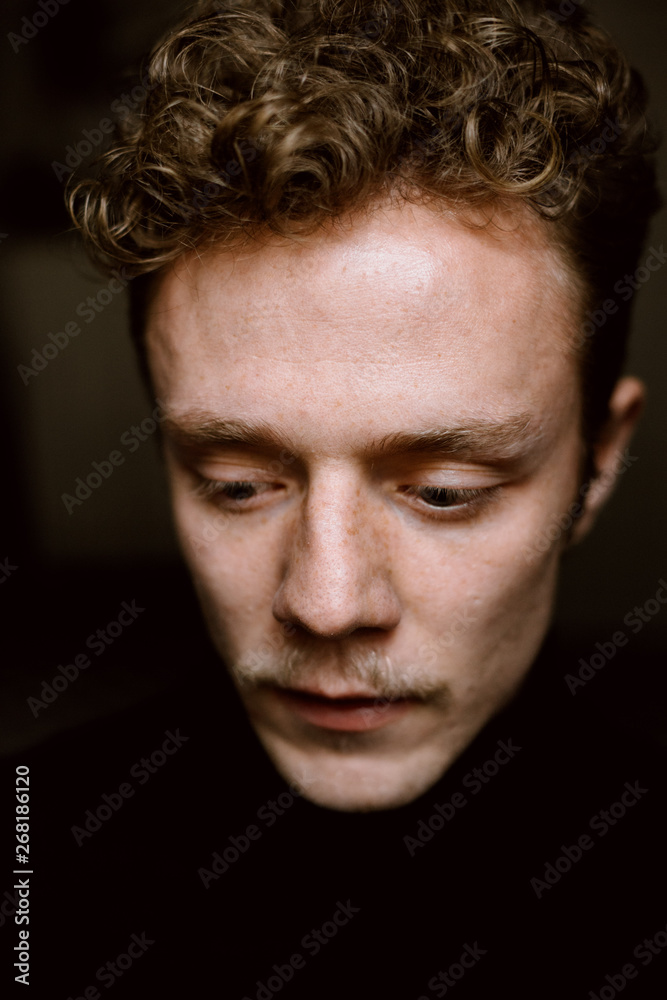 emotions on a young blonde man's face emotions on a young blonde man's face