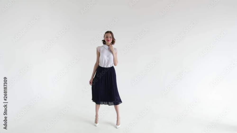 Sexy girl fashion model in white blouse posing on white background Sexy girl fashion model in white blouse posing on white background