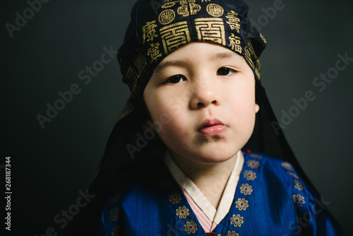 Closeup of little boy in hanbok photo