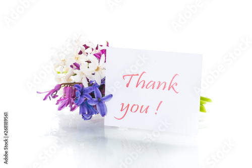 spring beautiful flowers of a hyacinth with a thank you card