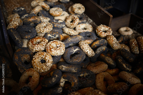 Pile of assorted bagels fresh out of the oven in a bakery photo