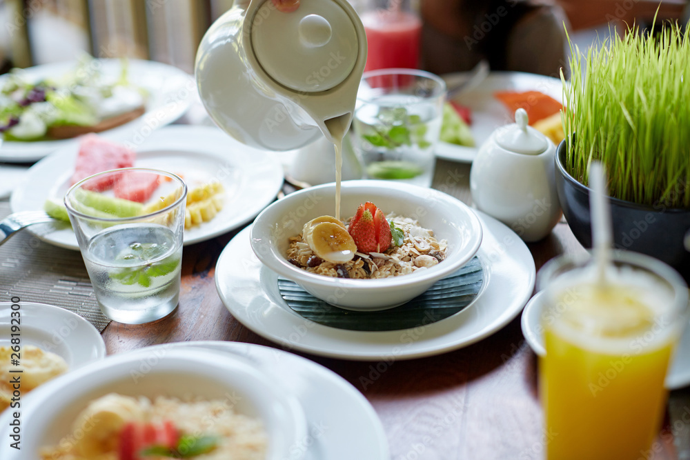 Rich and healthy breakfast on the table, on a sunny morning Rich and healthy breakfast on the table, on a sunny morning