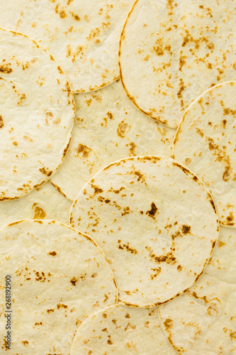 Freshly cooked soft flour tortillas, useful as background