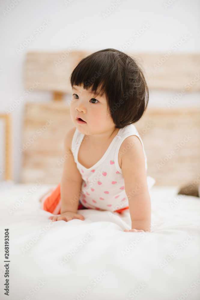 Baby girl in a bedroom Baby girl in a bedroom