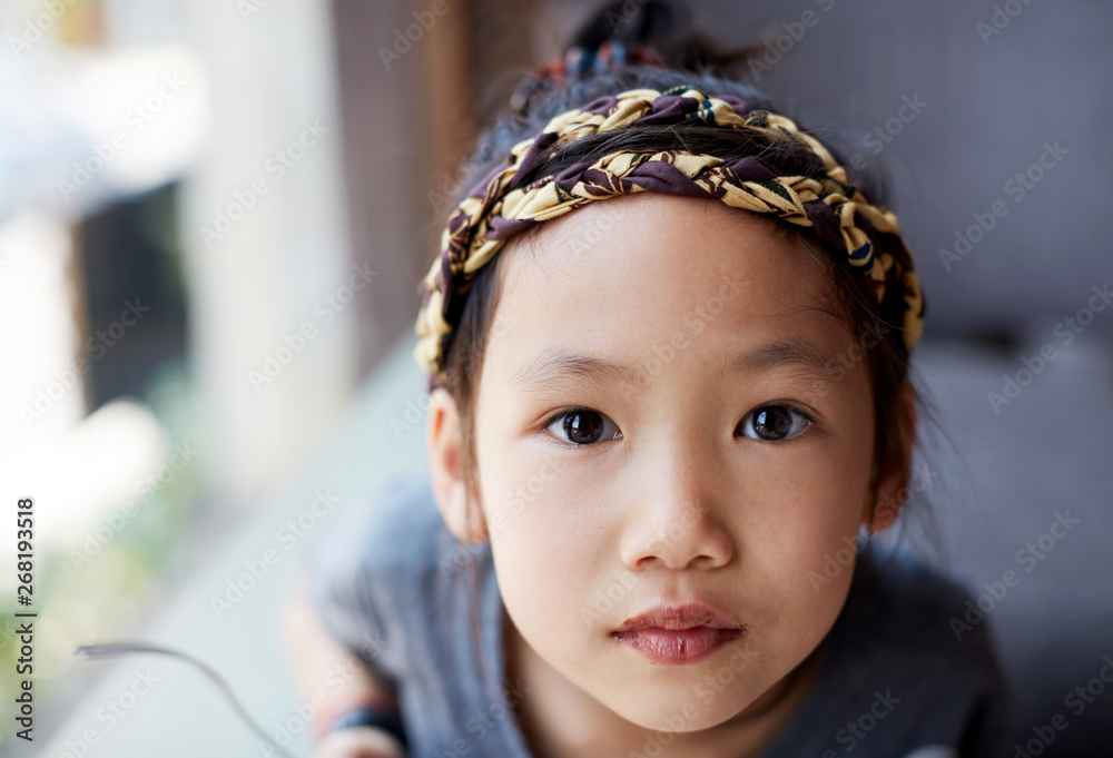 Cute Asian girl near the window Cute Asian girl near the window