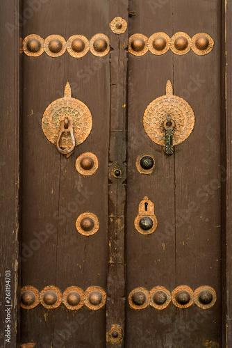Wooden door with vintage handles