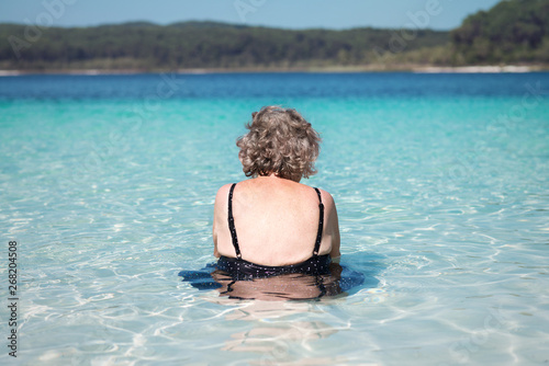 senior woman relaxing in a lake