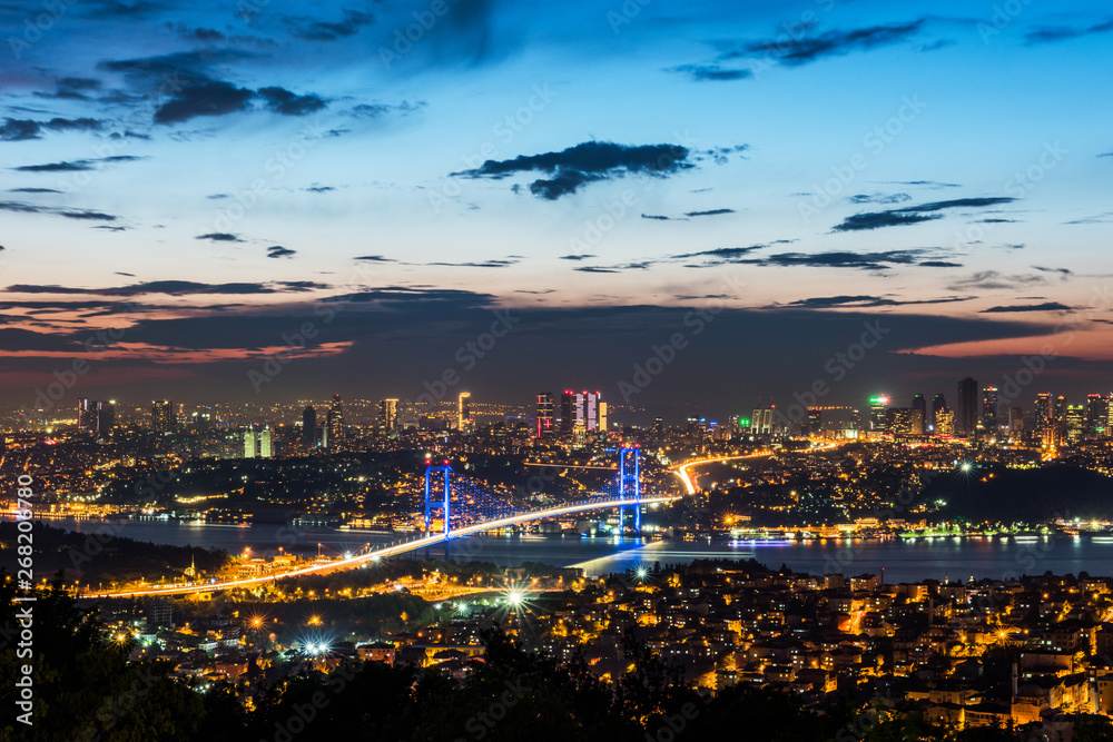Istanbul Bosphorus Bridge at sunset. 15th July Martyrs Bridge. Night view from Camlica Hill. Istanbul, Turkey.