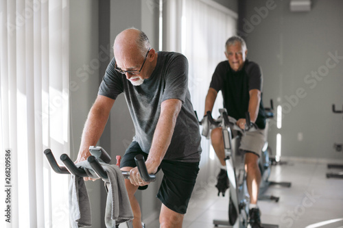 Man riding spin bike photo