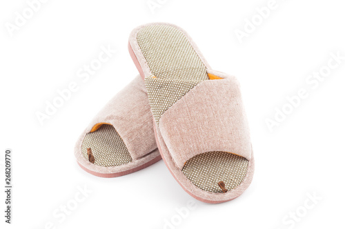 Pair of home slippers close up isolated on white background