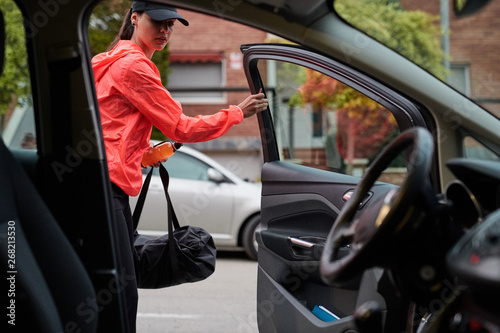 Woman Opening Car Door photo