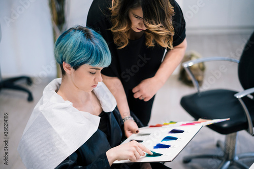 Young Woman dyeing her hair at a Salon