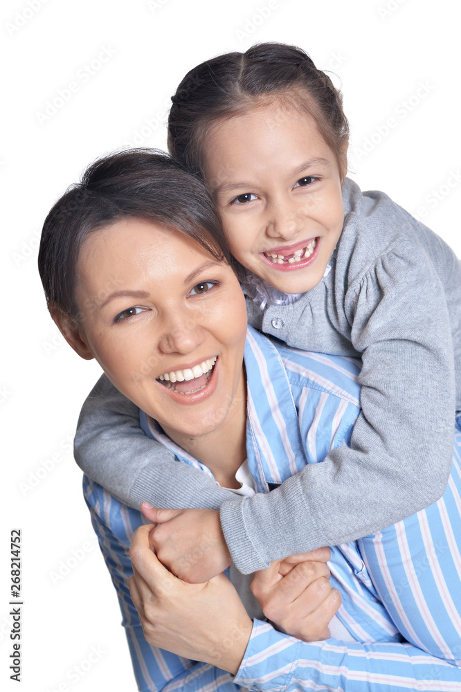 Happy mother with daughter posing on white background Happy mother with daughter posing on white background