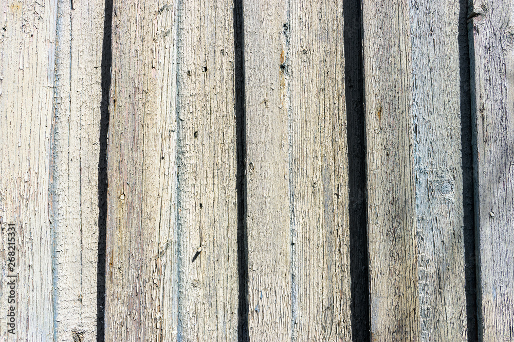 Naklejka premium weathered cracked blue color paint on rustic wooden crooked fence