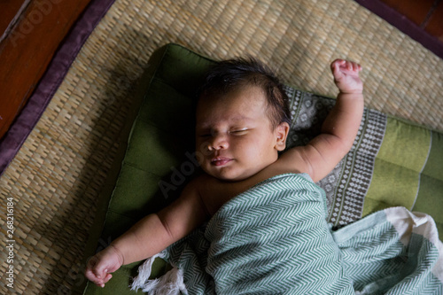 Baby on Green Cushion photo