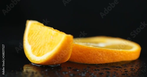 Close-up of a delicious ripe orange slices rotate