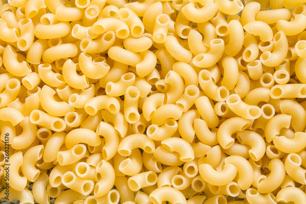 background of raw pasta in the shape of horns background of raw pasta in the shape of horns