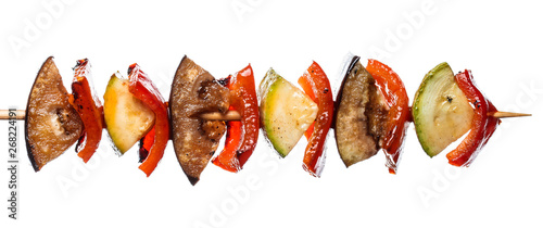 Картината върху платно Grilled vegetable kebab on skewer with tomato, pepper, zucchini, squash and eggplant on white background, isolated food