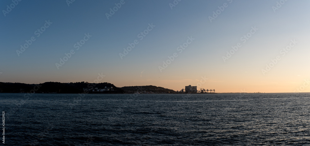 mouth of the Tagus river, lisbon, portugal, on sunset