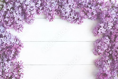 Spring branch lilac flowers on wooden table