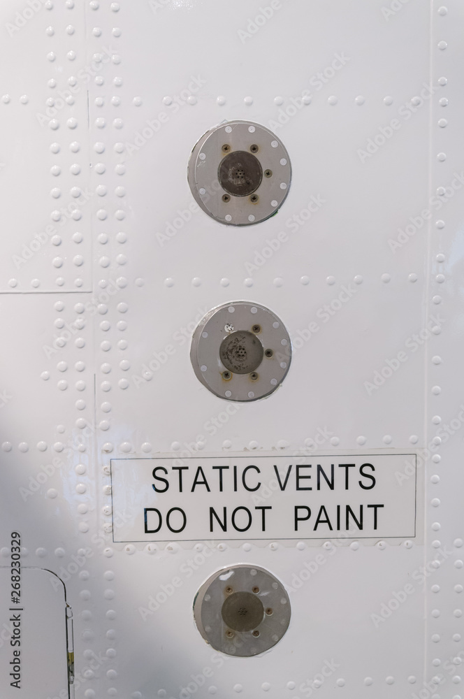 Static Vents On The Side Of An Airplane With A Warning Not To Paint 