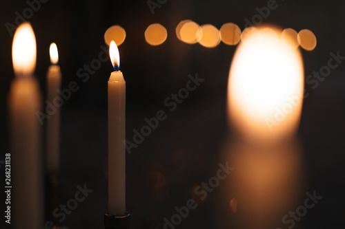 candles with fire on a dark background. close up