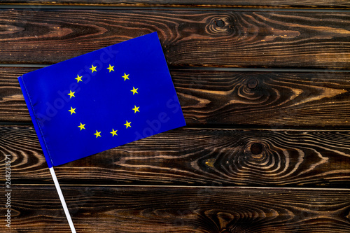 Konstfotografi National day of European Union concept with flag on wooden background top view
