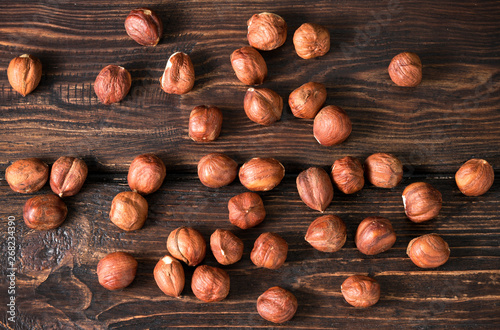 .hazelnuts top on wooden background