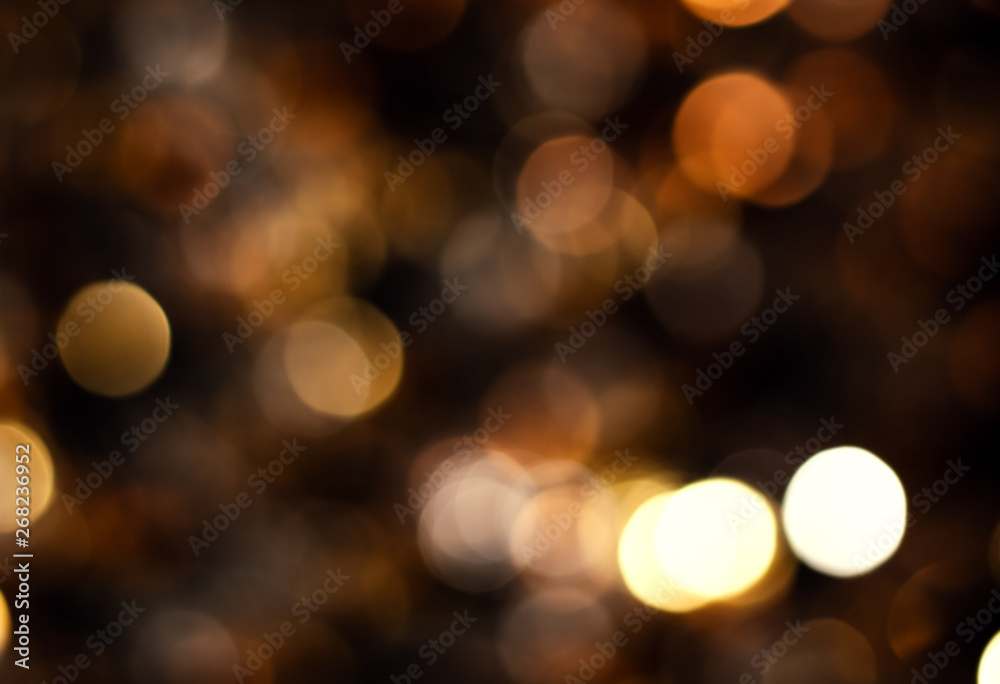 Blurred background of colored yellow lights