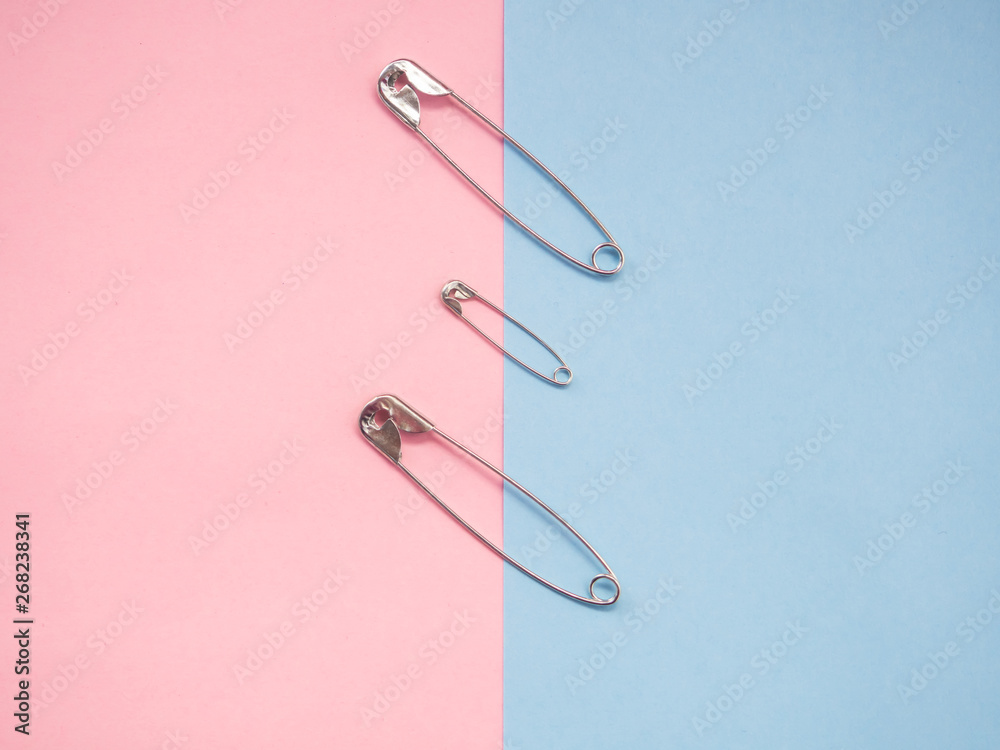 Several safety pins representing an unconventional family of gay, lesbian or transgender Several safety pins representing an unconventional family of gay, lesbian or transgender