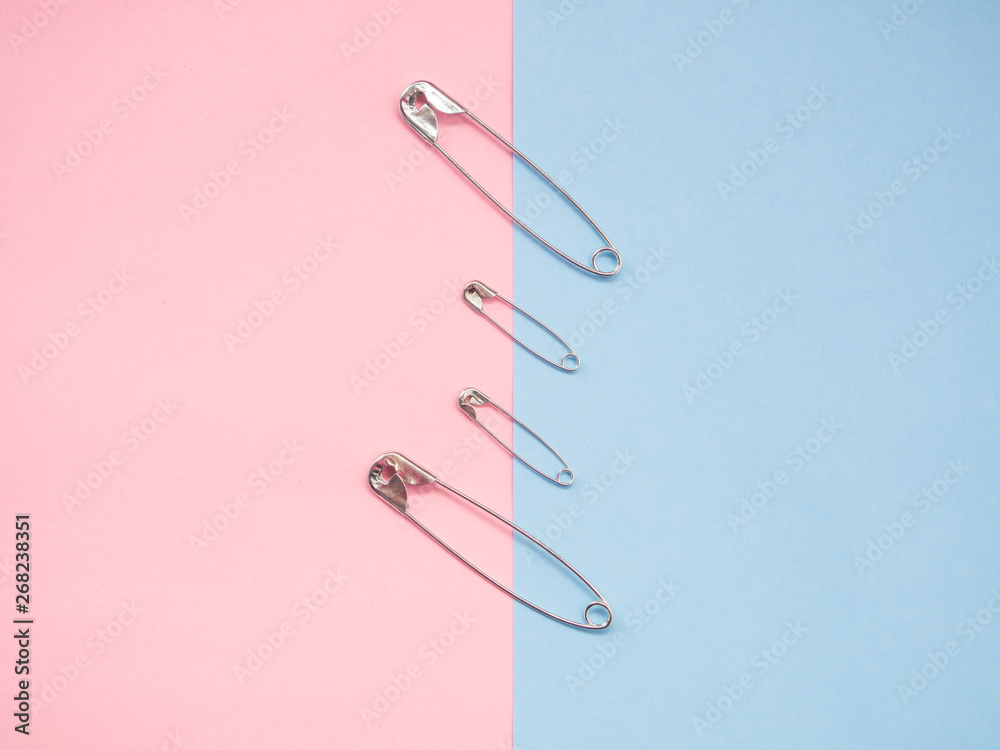 Several safety pins representing an unconventional family of gay, lesbian or transgender Several safety pins representing an unconventional family of gay, lesbian or transgender