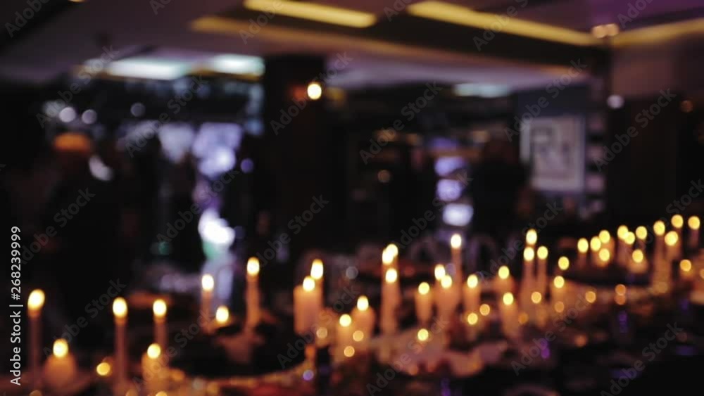 Festive table in a restaurant, people have dinner, celebration background
