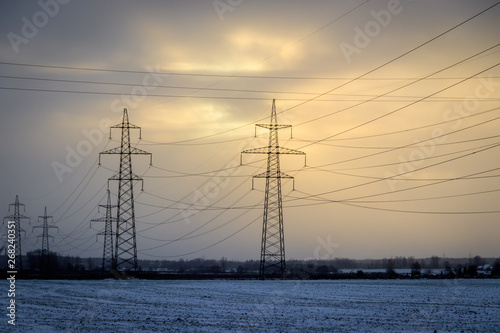 Electricity in the field at sunset. Electro industry.